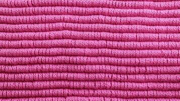 Generative AI, knitted pink sweater texture closeup, magenta or light pink abstract background photo
