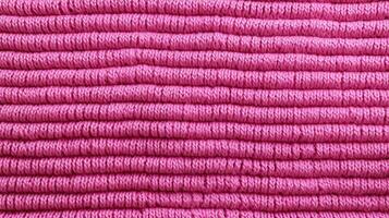 Generative AI, knitted pink sweater texture closeup, magenta or light pink abstract background photo