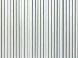 white corrugated cardboard sheet texture. useful as background. photo