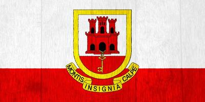 Gibraltar flag and coat of arms on a textured background. Concept collage. photo