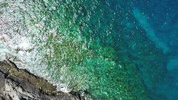 Drone view of big atlantic ocean waves meet the rocky coasts of the Canary Island of Tenerife. video