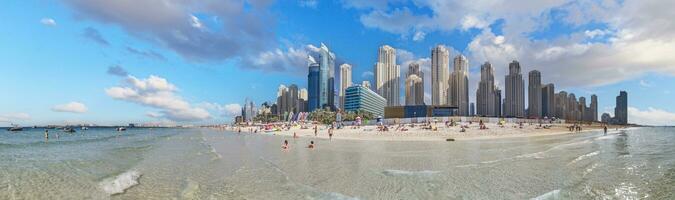 Panoramic view over beach and skyline of Marina district in Dubai photo