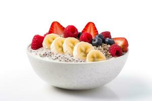 Vegan breakfast bowl of chia fruits coconut flakes isolated on a white background photo