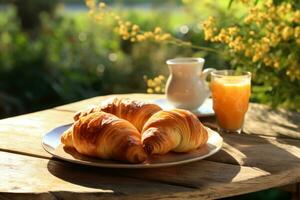 Golden croissants coffee and citrus juice sparkle in morning sunshine photo