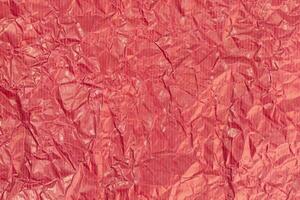 Red crumpled paper texture background. Full frame photo