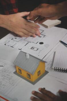 Engineer Teamwork Meeting, Drawing working on blueprint meeting for project working with partner on model building and engineering tools in working site, Construction and structure concept. photo