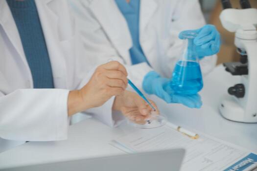 Team of Scientists Choose Between Printed Circuit Board to Work With. In The Background Technologically Advanced Scientific Research Center. photo