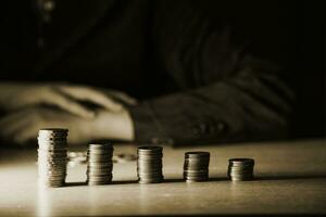 Money, Financial, Business Growth concept, Man's hand put money coins to stack of coins photo