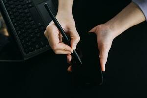 Asian Business woman using calculator and laptop for doing math finance on an office desk, tax, report, accounting, statistics, and analytical research concept photo