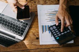Business Man Financial Inspector and Secretary Making Report, Calculating or Checking Balance. Internal Revenue Service Inspector Checking Document Audit Concept photo
