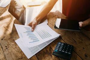 Business Man Financial Inspector and Secretary Making Report, Calculating or Checking Balance. Internal Revenue Service Inspector Checking Document Audit Concept photo
