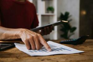 Business Man Financial Inspector and Secretary Making Report, Calculating or Checking Balance. Internal Revenue Service Inspector Checking Document Audit Concept photo
