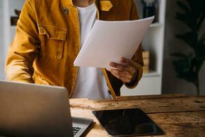 Business Man Financial Inspector and Secretary Making Report, Calculating or Checking Balance. Internal Revenue Service Inspector Checking Document Audit Concept photo