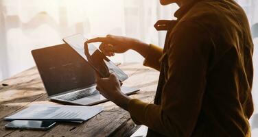 Business Man Financial Inspector and Secretary Making Report, Calculating or Checking Balance. Internal Revenue Service Inspector Checking Document Audit Concept photo