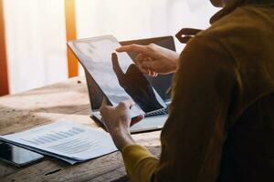 Business Man Financial Inspector and Secretary Making Report, Calculating or Checking Balance. Internal Revenue Service Inspector Checking Document Audit Concept photo