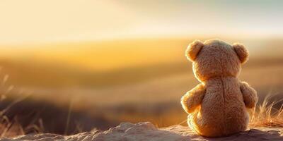 ai generado. ai generativo. solo desaparecido uno juguete muñeca pequeño oso sentado mirando en puesta de sol antecedentes paisaje exterior. gráfico Arte foto