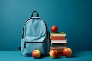 Back to School Essentials Blue Backpack, Books, and Apples. Generative By Ai photo