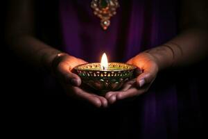 Diwali Hindu Festival of lights celebration. Diya oil lamp lit in woman hands. AI generated photo