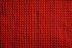 Knitted texture. Detail of a warm winter sweater. Generative AI photo