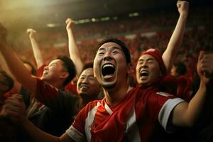 Excited Japan football fans cheering for their team during a game at stadium. ai generated pro photo