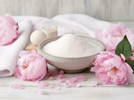 Spa set of spa treatment elements on white wooden,Peonies White towel,pink herbal salt.Generative Ai. photo