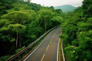 Road winds through the lush forest with modern cars driving through the trees.Generative Ai. photo