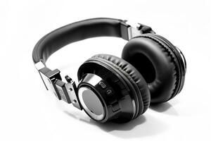 Black leather headphones isolated on white background photo