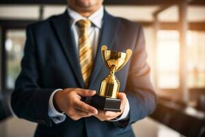 Businessman showing trophy to show victory.Generative Ai. photo