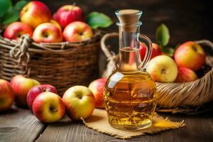 Apple cider in a glass jug and a basket of fresh apples photo