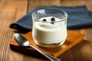 yogur en vaso con cuchara en de madera antecedentes foto