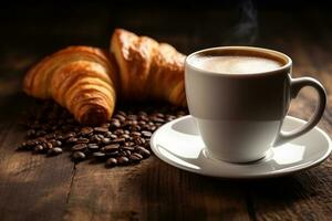 White coffee cup and fresh croissants on wooden background photo
