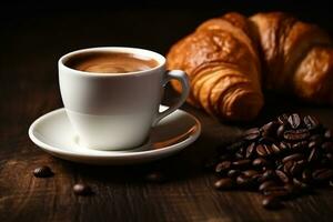 White coffee cup and fresh croissants on wooden background photo