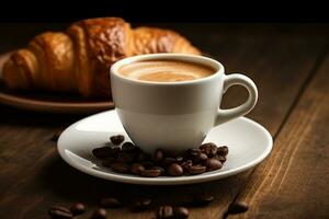 White coffee cup and fresh croissants on wooden background photo
