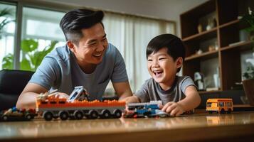 Dad with a boy of 10 years old plays a constructor photo