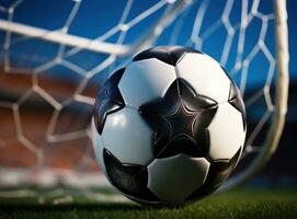 Soccer ball lying in the goal net photo