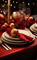 Christmas table setting with christmas gold and red dinnerware photo