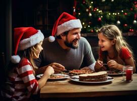 Family with christmas hats eating photo