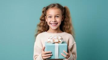 Girl with gift box on vivid background photo