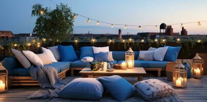 Rooftop terrace decorated with outdoor lighting and pillows photo