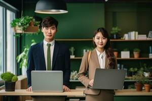 Young adult couple is smiling happy in office portrait photo