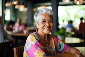 Smiling senior woman in a restaurant photo