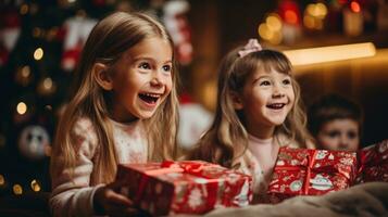 Excited children opening their presents on Christmas morning photo