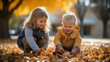 Children playing with fall leaves outside photo