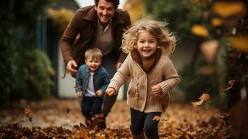 Family playing in leaves in backyard photo