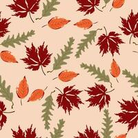 Hand drawn seamless pattern with leaves in autumn colors. vector