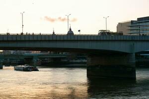 Best View of Boat over River Thames Waters at London Bridge, Capital City of England Great Britain. The Image Was Captured June 4th, 2023 photo