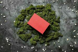 Present box green moss christmas wallpaper stone scratched background red xmas box photo