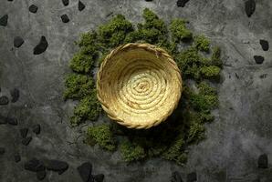 Straw basket green moss black coal kitchen background photo