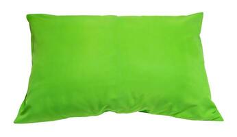 Top view of green pillow at hotel or resort room isolated on white background with clipping path. Concept of comfortable and happy sleep in daily life photo