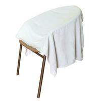 Used white towel laying on chair isolated on white background with clipping path photo